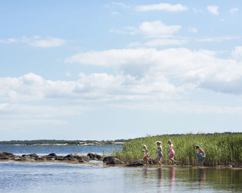 Children running at water