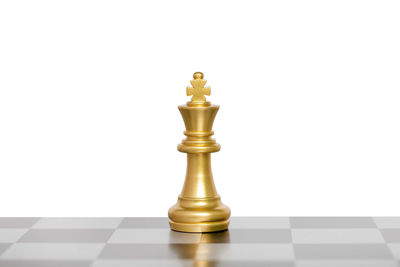 Close-up of chess pieces against white background