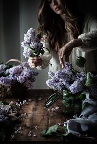 People on table by potted plant