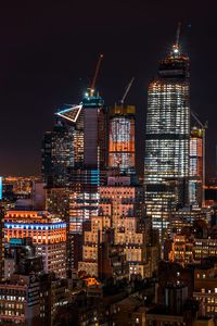 Illuminated buildings in city at night