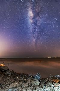 Scenic view of sea against sky at night