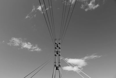 Low angle view of cables against sky