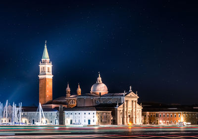 Illuminated cathedral against sky at night