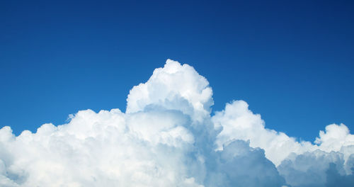 Low angle view of clouds against blue sky