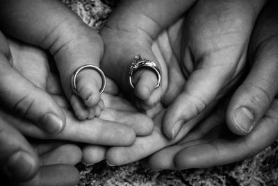 Midsection of couple holding hands