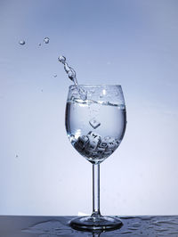 Close-up of water splashing in glass