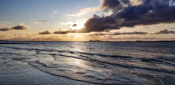 Scenic view of sea against sky during sunset