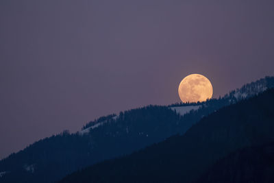 Low angle view of moon against sky at night