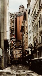 Street amidst buildings in city against sky