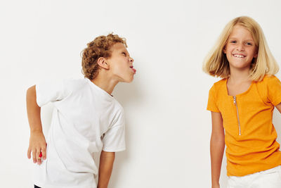 Cute sibling against white background