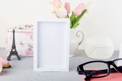 Close-up of white flower vase on table