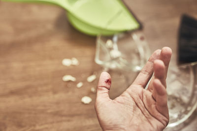 Cropped hand of person holding pills