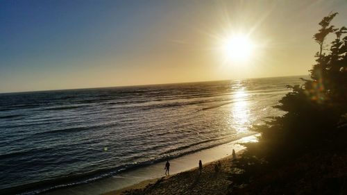 Scenic view of sea against clear sky during sunset