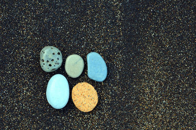 High angle view of stones on sand
