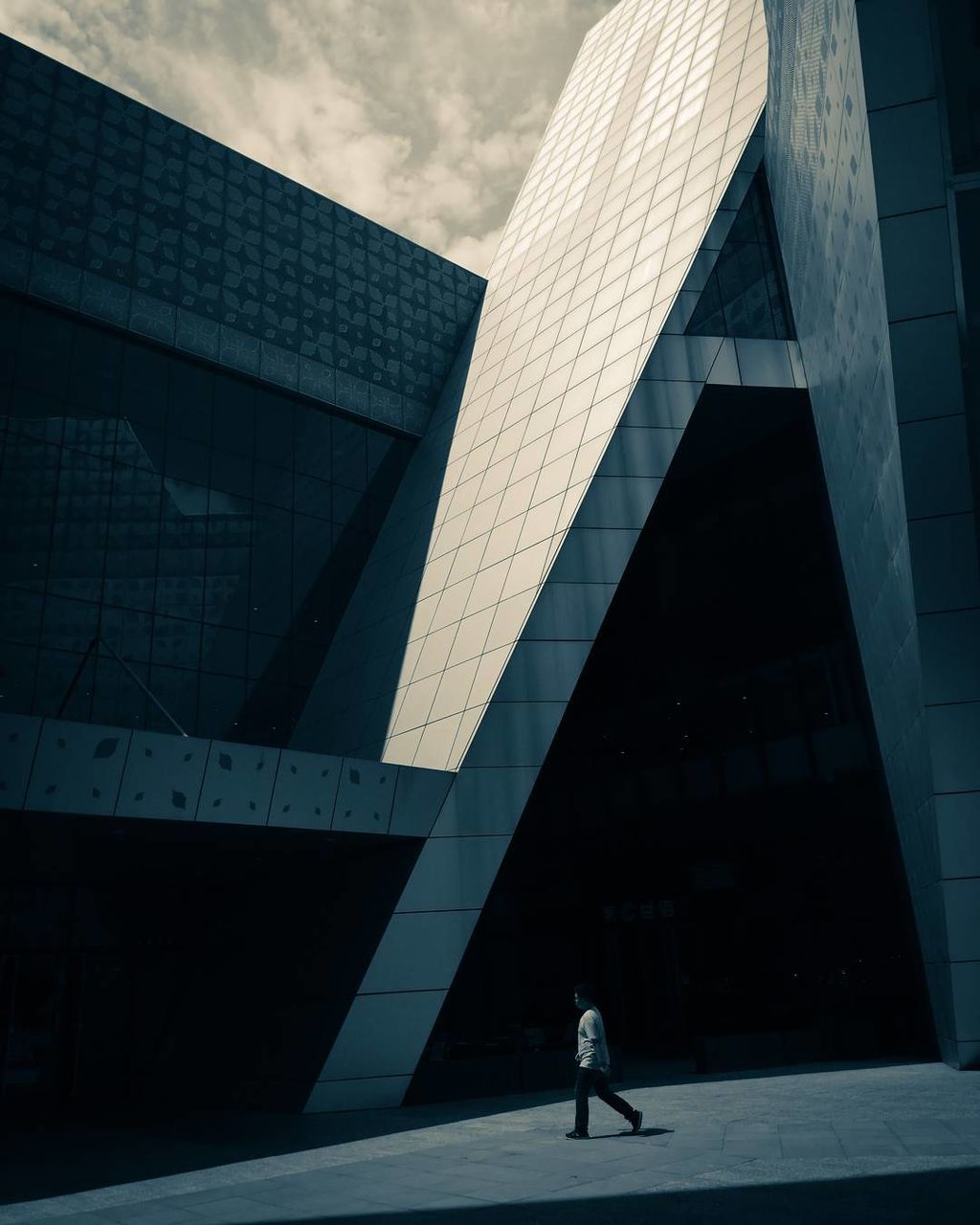 MAN WALKING ON OFFICE BUILDING