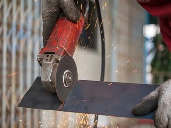 Close-up of man working on wood