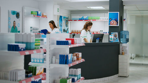 Rear view of woman standing in store