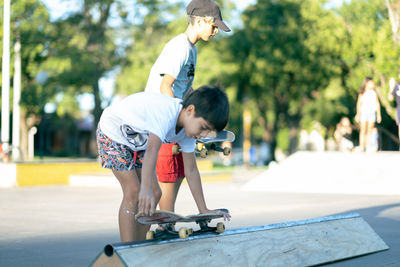 Portrait of children having fun in skatepark