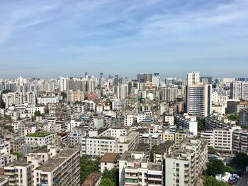 High angle view of buildings in city against sky