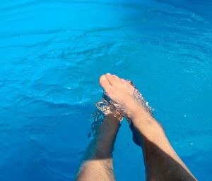 Low section of woman in swimming pool