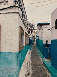 Narrow alley amidst buildings in town