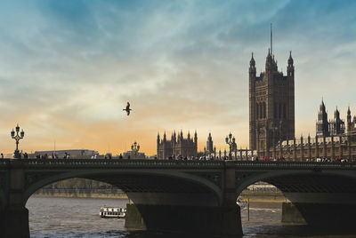 Bridge over river with buildings in background