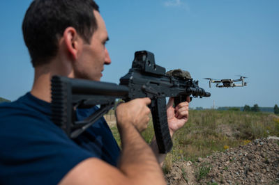 Close-up of man holding camera