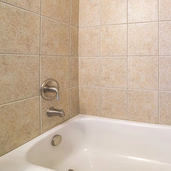 Low section of woman standing in bathroom