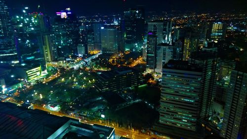 Aerial view of illuminated city at night