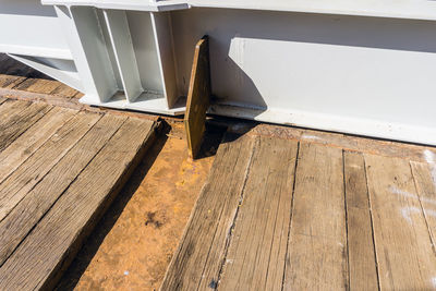 High angle view of chair on hardwood floor