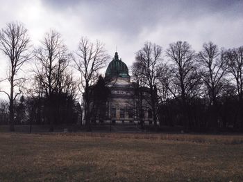 Low angle view of building against cloudy sky