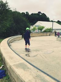 Rear view of boy on skateboard