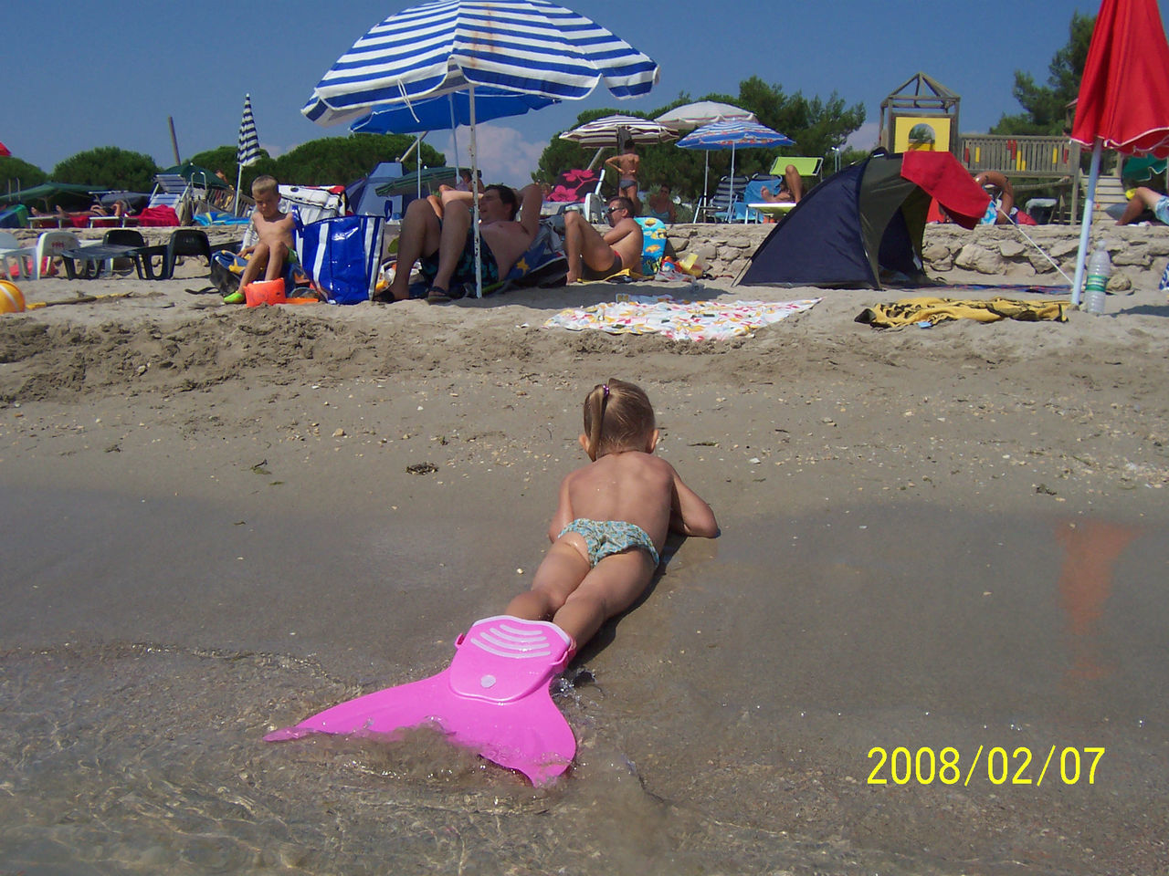 WOMAN JUMPING ON BEACH