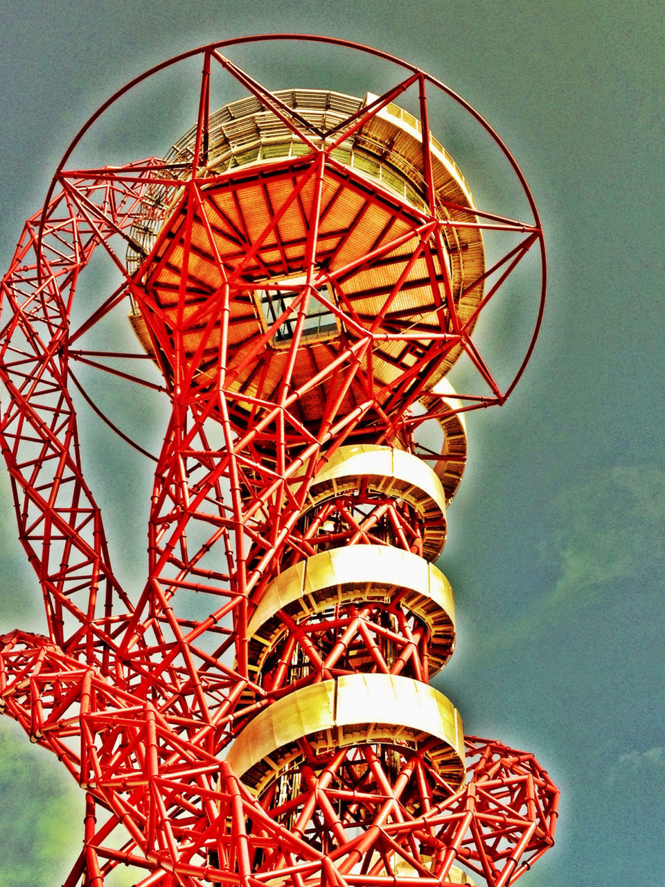 low angle view, amusement park ride, amusement park, arts culture and entertainment, ferris wheel, clear sky, red, sky, built structure, metal, architecture, pattern, day, outdoors, large, no people, tower, design, fun, multi colored