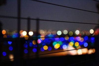 Defocused image of illuminated lights at night