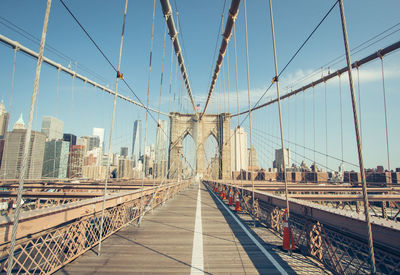 Brooklyn bridge in city against sky