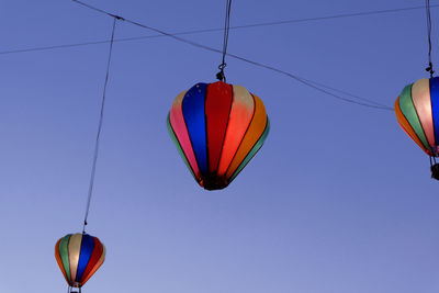 Low angle view of hot air balloon against clear sky