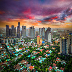 High angle view of cityscape against cloudy sky