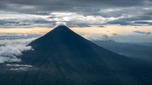 Scenic view of landscape against cloudy sky