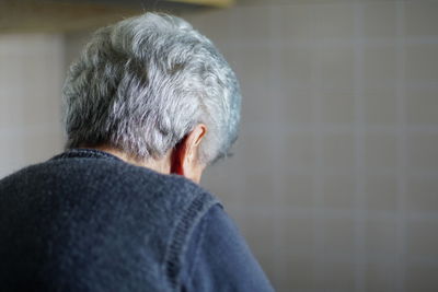 Rear view of man wearing mask