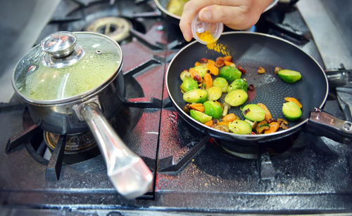 Cropped hand preparing food