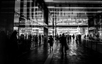 Crowd in illuminated city at night