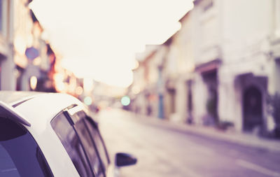 Close-up of a cars on road in city