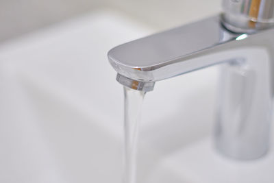 Close-up of faucet on table