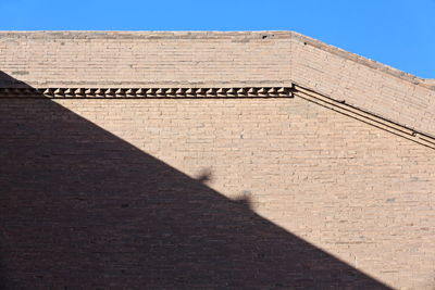 Low angle view of brick wall