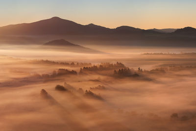 Scenic view of mountains against sky during sunset