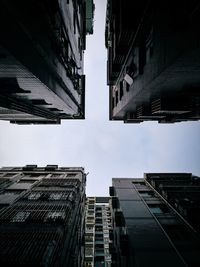 Low angle view of buildings against sky in city