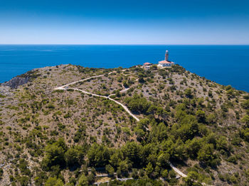 Scenic view of sea and buildings against sky