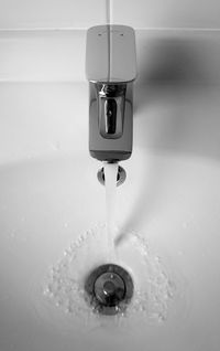 Close-up of water faucet in bathroom