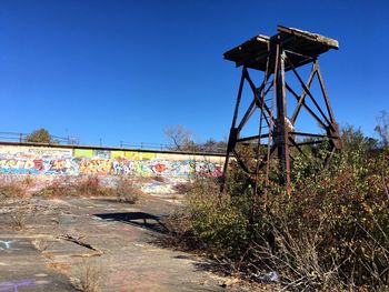 Low angle view of multi colored against clear blue sky